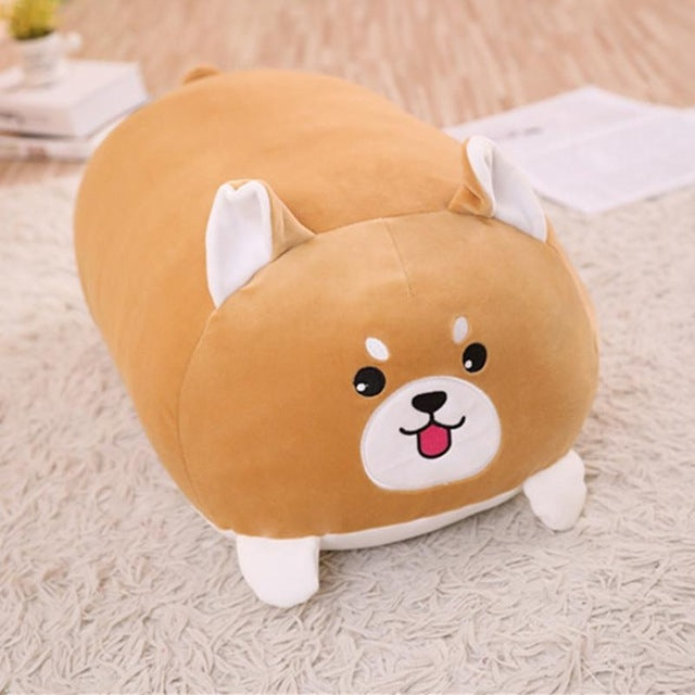 Brown plush dog cushion pillow with white muzzle and open-mouth smile