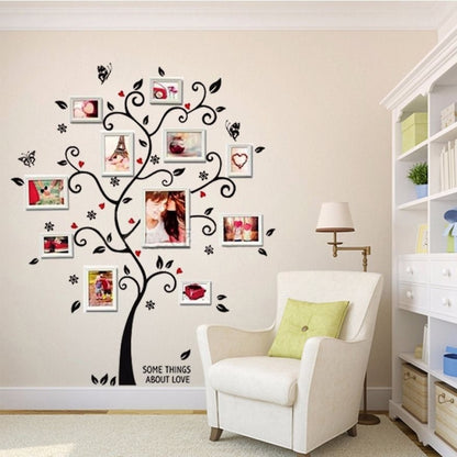 Photo tree wall sticker with swirled branches, black leaves, and multiple photo frames