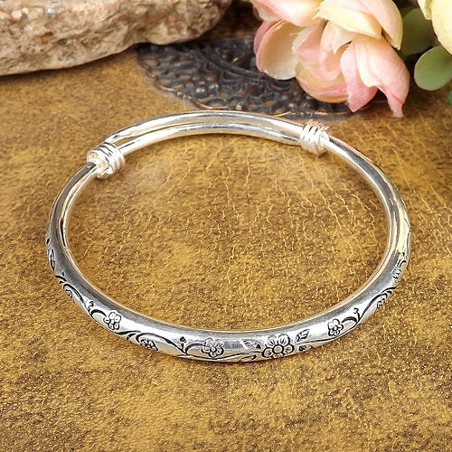 Silver carved cuff bangle with floral etching and twist detail, Tibetan style
