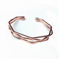 Rose gold multi-row open cuff bracelet with geometric, angular link design.