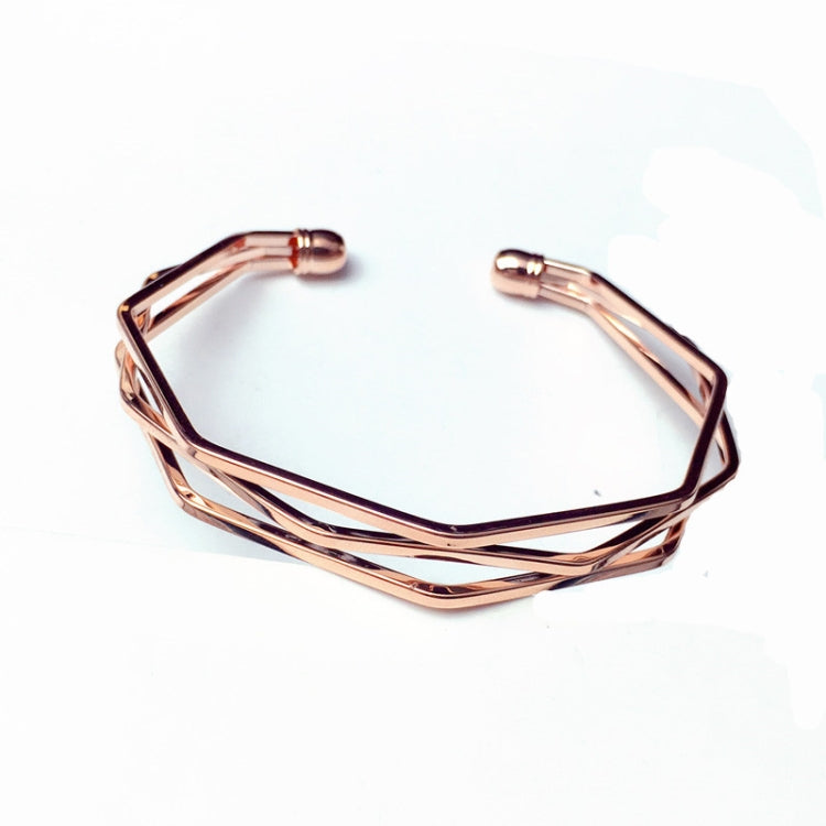 Rose gold multi-row open cuff bracelet with geometric, angular link design.