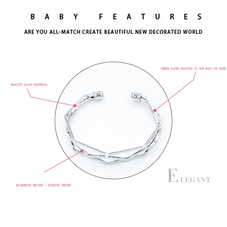 Silver three-layer open cuff charm bracelet showing faceted link shape.
