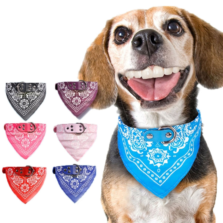 Dog wearing blue printed bandana collar with metal buckle; assorted bandana collars behind