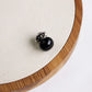 Black pearl stud collar pin, close-up on button bead and backing