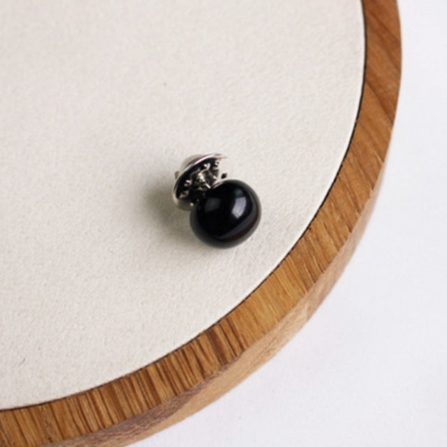 Black pearl stud collar pin, close-up on button bead and backing