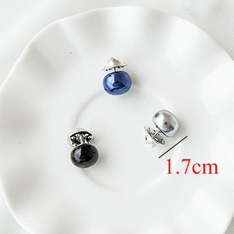 Assorted pearl collar pins with blue, silver, and black beads on display plate