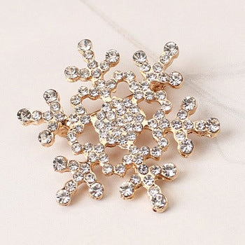 Silver-tone rhinestone snowflake brooch with crystal-like sparkly stones