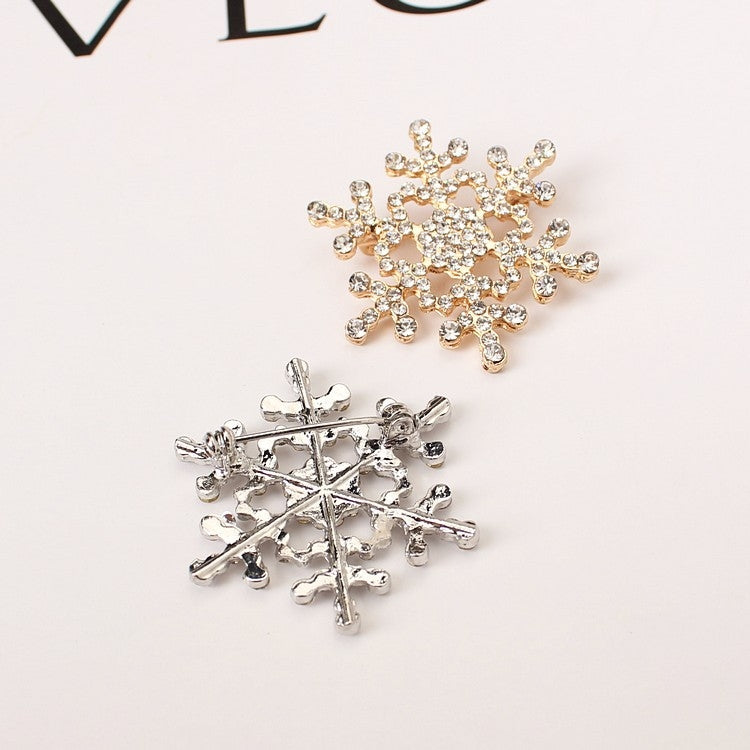 Silver-tone rhinestone snowflake brooch back with metal pin clasp