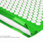 Green acupuncture massage pad with white acupoint disks and stitched edge flap