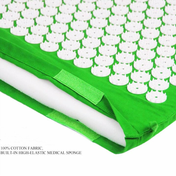 Green acupuncture massage pad with white acupoint disks and stitched edge flap