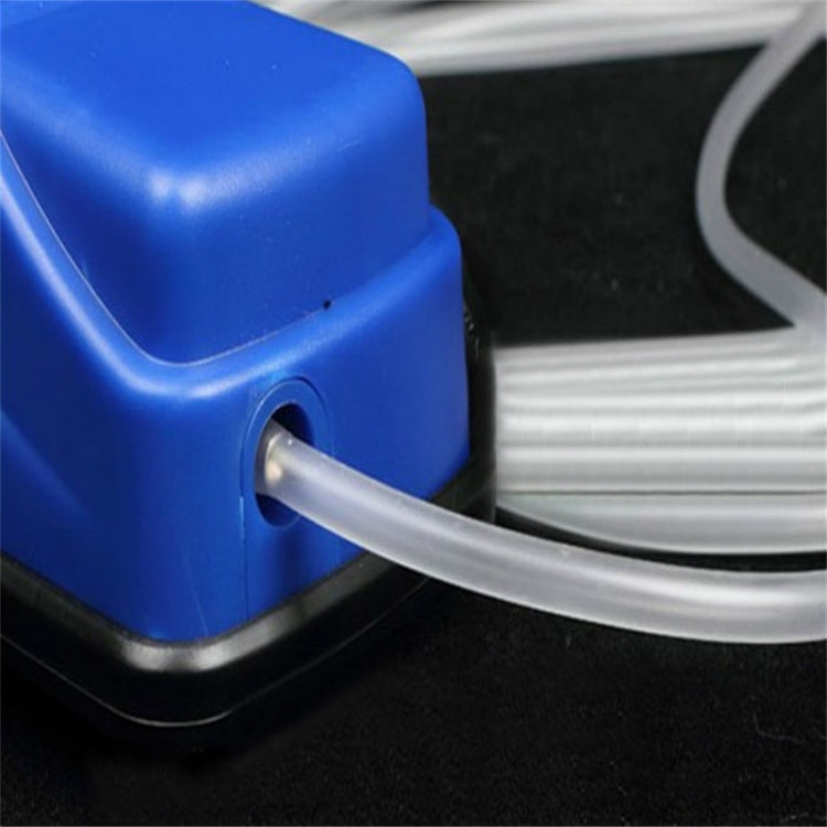 Silicone air hose tubing connected to air pump outlet near blue pump