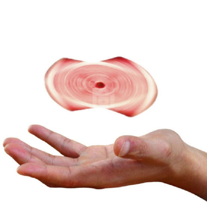 Magic trick prop with a red spinning disc hovering above an open hand