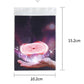 Packaged magic prop featuring a red spinning disc artwork, 10.2 cm x 15.2 cm