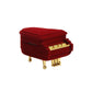 Red velvet piano-shaped jewelry box, closed with gold front detail and small black latch