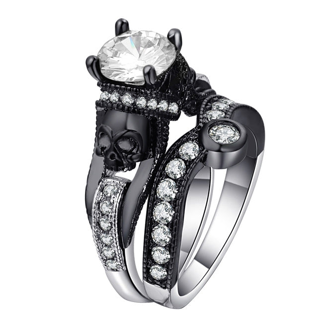 Skull ring with white round-cut stones and large clear center gem