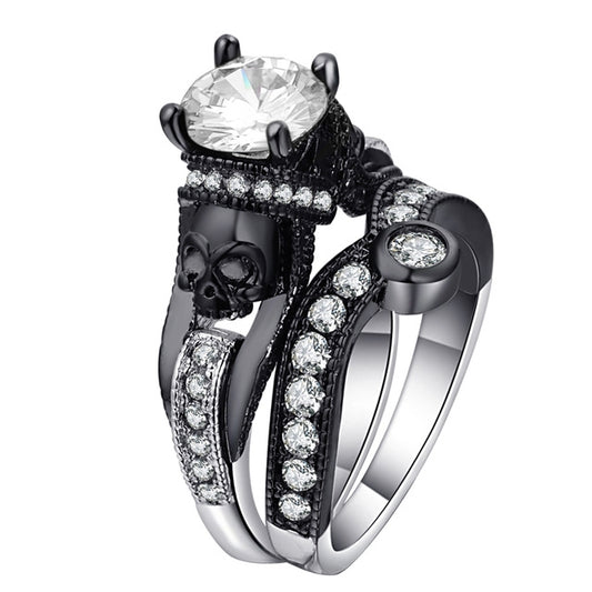 Skull ring with white round-cut stones and large clear center gem