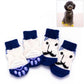 Set of pet knitted anti-slip socks in navy and white with cartoon puppy face artwork
