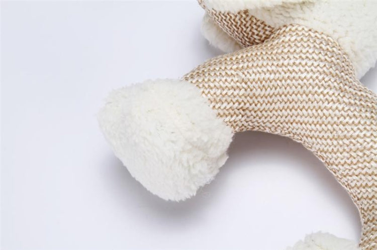 Cream plush dog chew toy close-up with textured fabric and soft plush detail