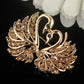 Gold-tone rhinestone swan brooch, detailed crystal wings and heart-like base
