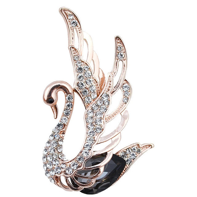 Rose-gold tone swan crystal brooch with sparkly clear stones and layered wing design