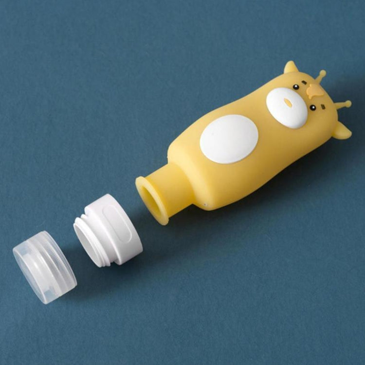 Yellow giraffe-shaped travel lotion bottle with clear pump cap
