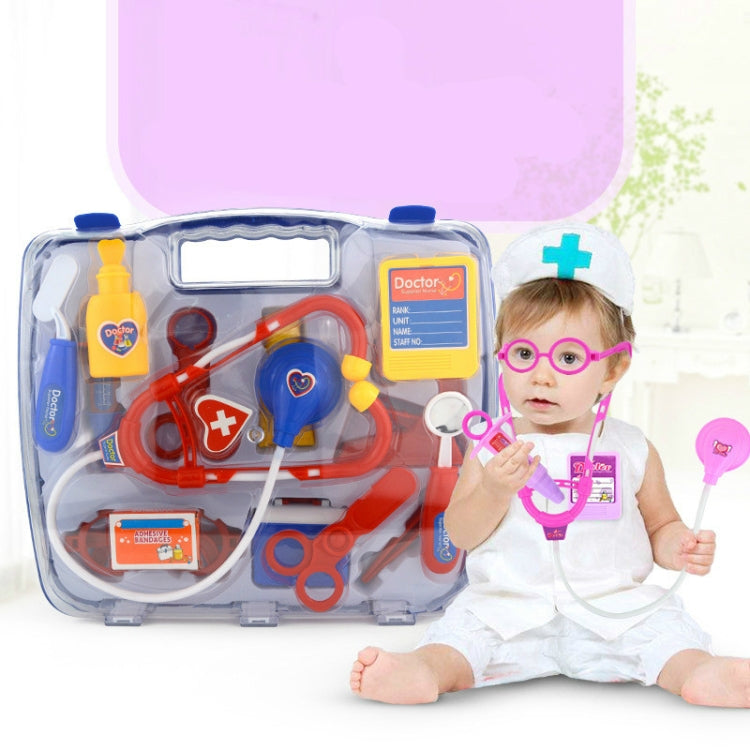 Toddler playing doctor with purple stethoscope set and white doctor hat