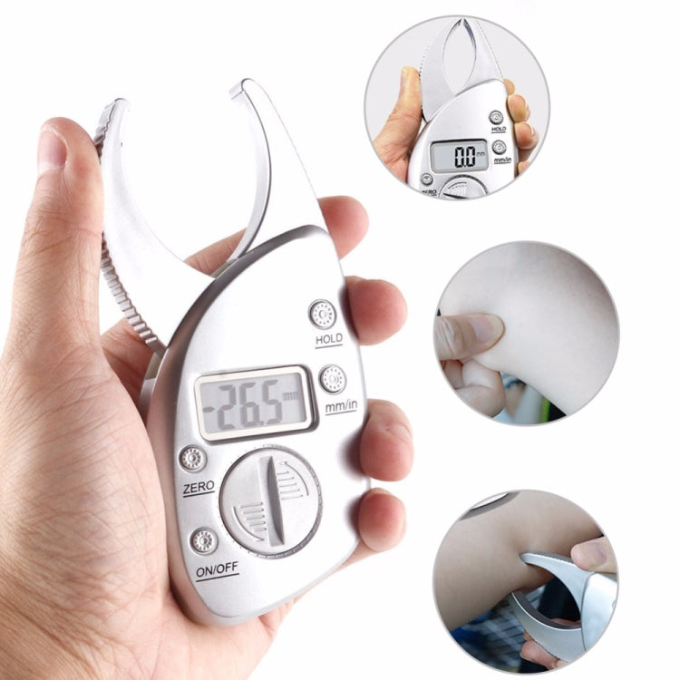 Silver digital caliper held in hand with LCD reading