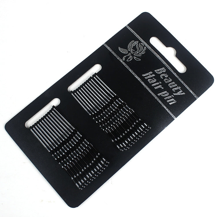3-piece hair clip set with black and silver-tone comb teeth on display card