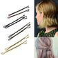 Hair barrette clips set shown on hair, with black and gold tones
