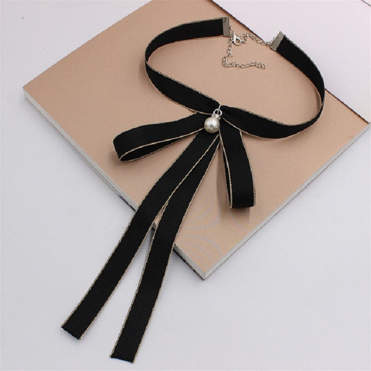 Women’s black ribbon bow tie with pearl center and long hanging ribbon tails