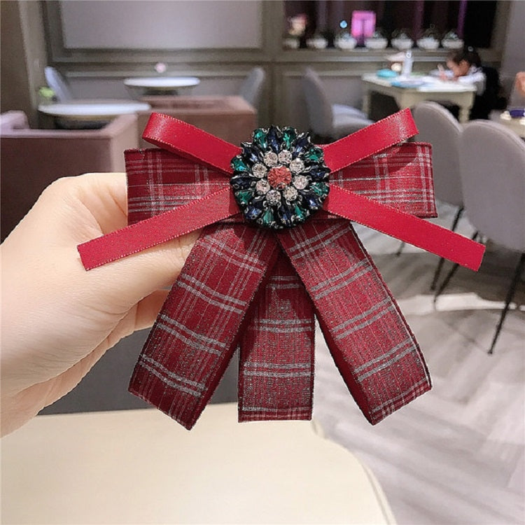 Red plaid bow brooch with jeweled diamond centerpiece and matching red ribbon bow