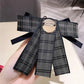 Navy and gray plaid bow brooch with jeweled centerpiece and black ribbon streamers