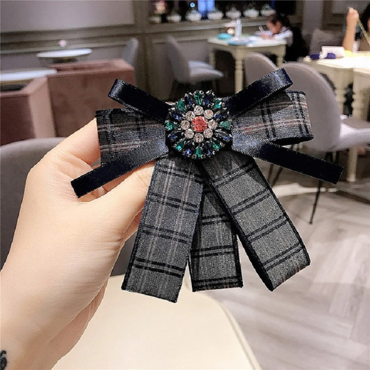 Black and gray plaid bow brooch with jeweled centerpiece and black ribbon bow