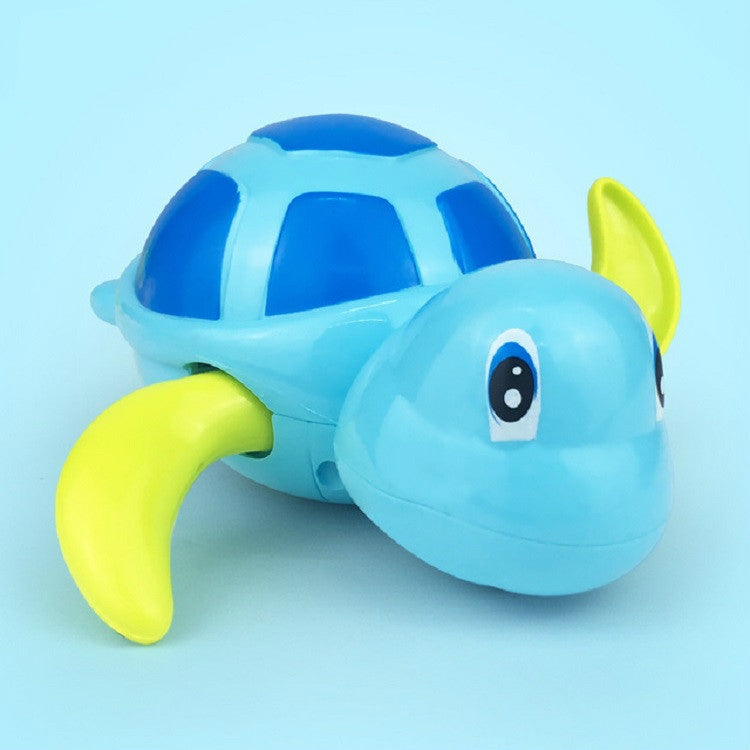 Light blue turtle water play toy with green fin and side view
