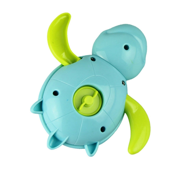 Light blue turtle-shaped bath toy with green shell wheel detail