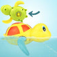 Yellow and red cartoon turtle bath water toy with dolphin-style fins