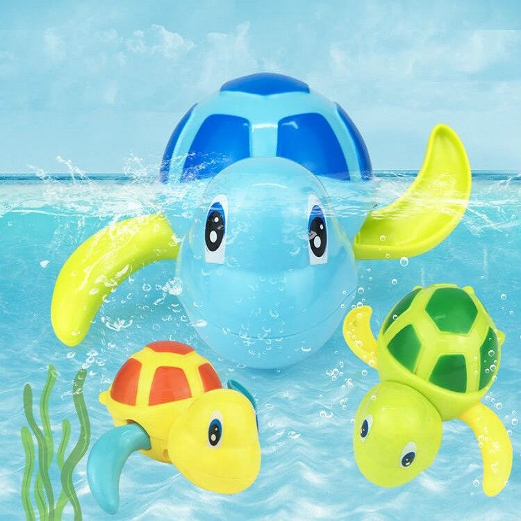 Light blue cartoon turtle bath water toy with green and yellow turtle friends