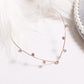 Gold crystal headband with evenly spaced rhinestone drops along the band