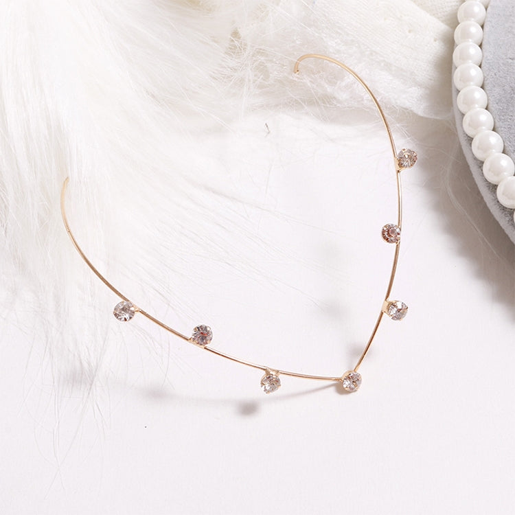 Gold crystal headband with evenly spaced rhinestone drops along the band