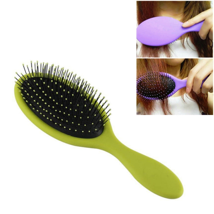Lime green hair brush with oval black bristle pad and long handle