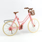 Mini dollhouse bicycle with pink frame, tan wheels, brown rear stand and front guard