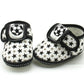 Baby prewalker shoes in black with star pattern and soccer patch, hook-and-loop strap