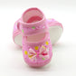 Baby prewalker shoes in pink with bow and dot print, soft sole, strap closure