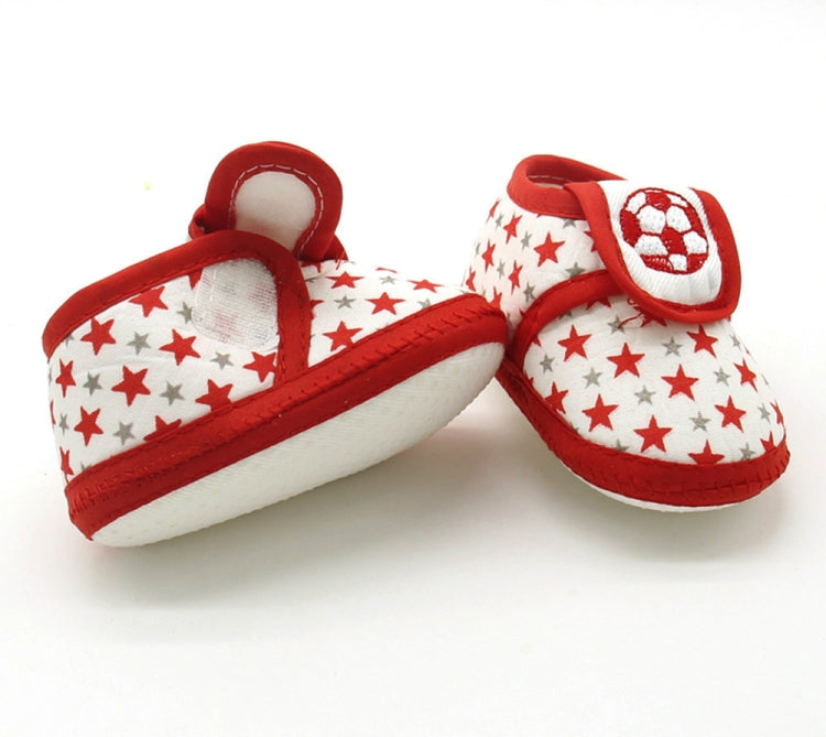 Baby prewalker shoes in red with star pattern and soccer patch, side view