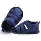 Blue toddler canvas sandals with crisscross Velcro straps and cushioned lining