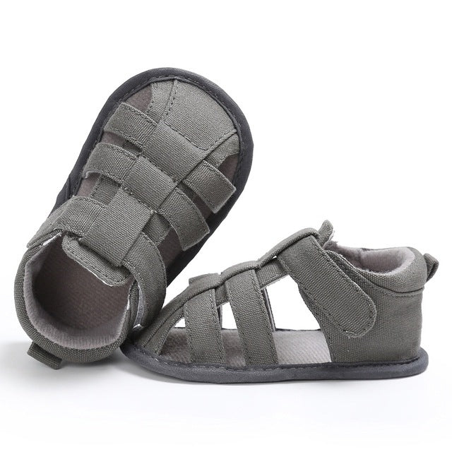 Grey toddler canvas sandals with Velcro strap top and flexible rubber sole