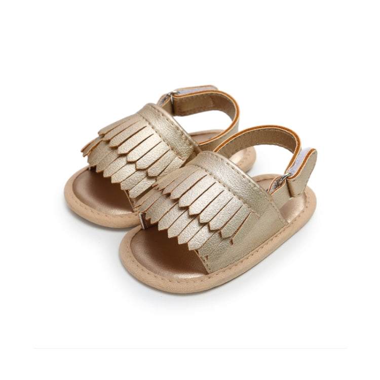 Beige fringed baby sandals with hook-and-loop ankle straps and open toe