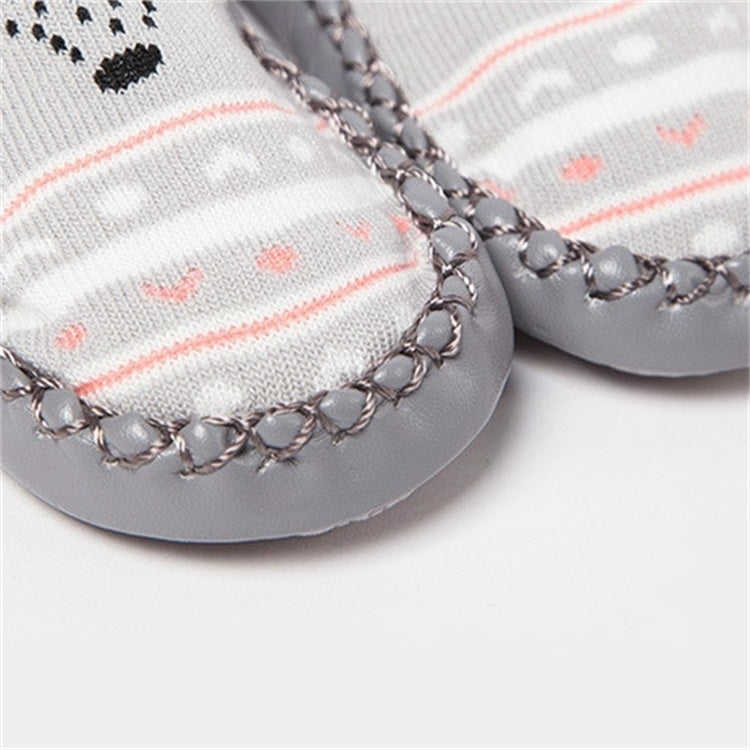 Gray non-slip toddler socks with textured grip sole and stitched trim