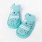 Baby non-slip cotton toddler socks in blue, bear graphic with striped cuffs and grippy sole