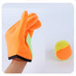 Child hands wearing orange plush catching glove with green pad, plus orange sticky ball.